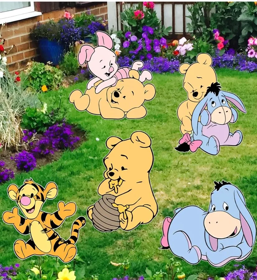 Winnie the Pooh character lawn stakes in a garden
